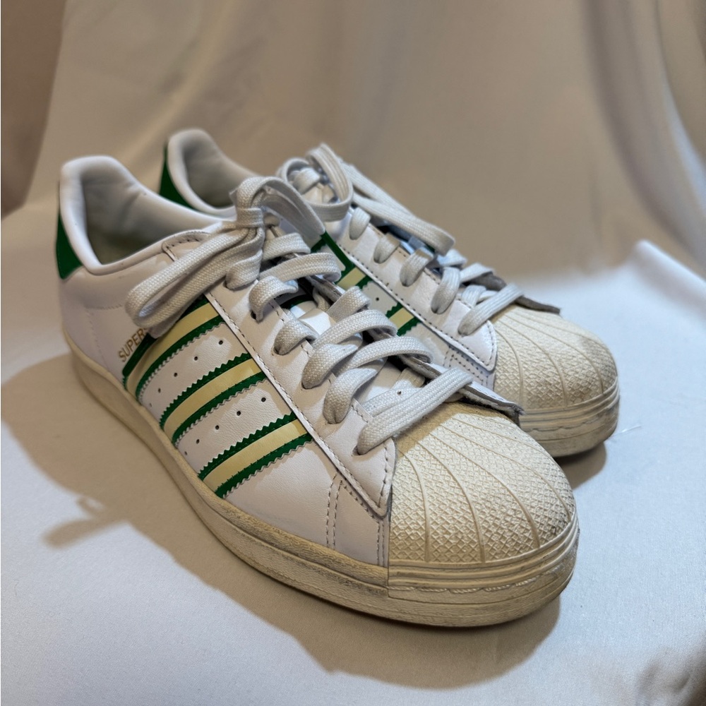 Adidas superstar green and white sneakers